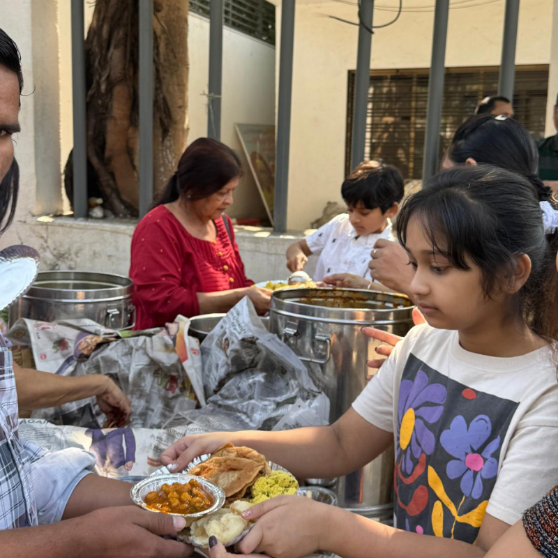CSR activity by Smile Invent Dental Clinic distributing food