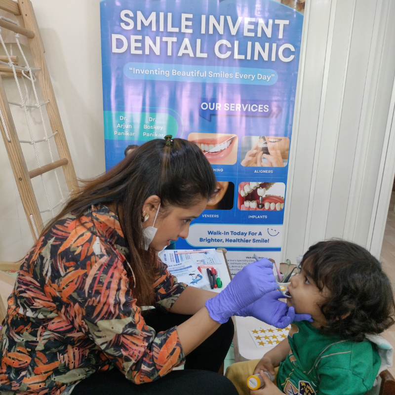 Dentist explaining oral care to kids