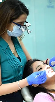 Dr. Boskey Panikar treating a young patient