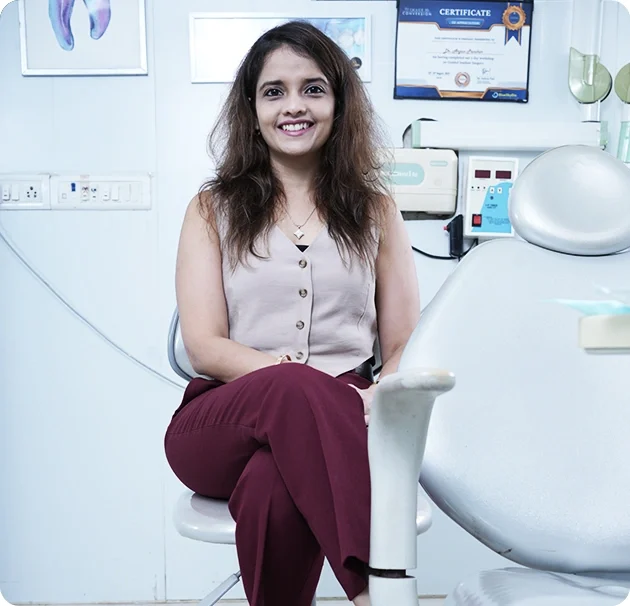 Dr. Boskey Panikar, Periodontist and Cosmetic Dentist, at Smile Invent Dental Clinic